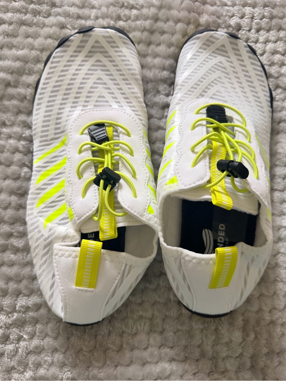 Grounded White and Neon Yellow Athletic Slip-On Shoes